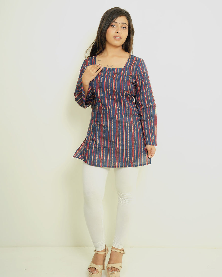 Model wearing Anandira Neelrekha indigo multicolour striped short kurti with square neck and flared sleeves